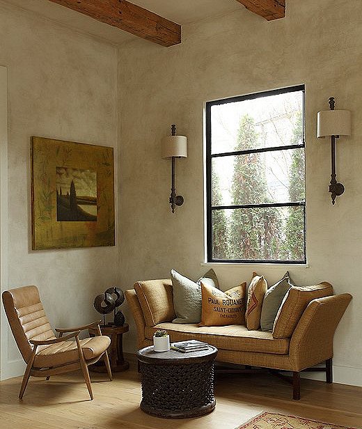 This bench from Barclay Butera was the first thing Tish had bought for the couple’s previous home. This sitting area is to the rear of the kitchen and provides a nice quiet moment. 
