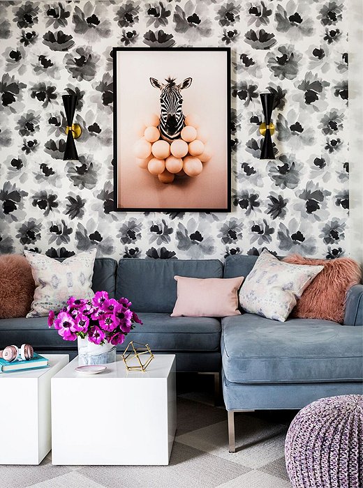 The playroom’s palette is consistent with that of the rest of the apartment, but the space contains a few extra-playful finishing touches, such as shaggy-haired throw pillows and graphic wallpaper. For a similar sectional, see the Marceau.
