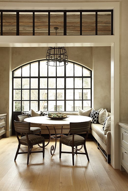 The breakfast room, which is their usual dining spot, was made to feel like an enclosed porch, according to Tish. Architect Keith Summerour installed his signature steel windows to let in natural light.
