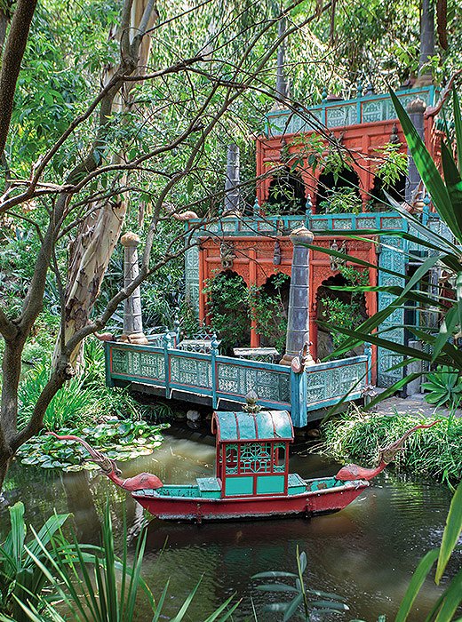 The gardens feature a temple crafted of Indian wood panels, a koi pond, and a Vietnamese wedding boat. 
