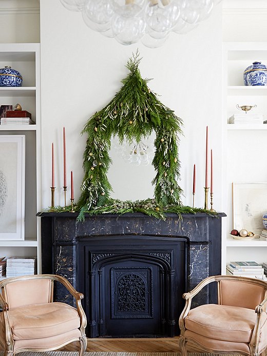 This DIY, which uses sprigs of fresh greenery to create a festive frame around a mirror. Photo by Manuel Rodriguez.
