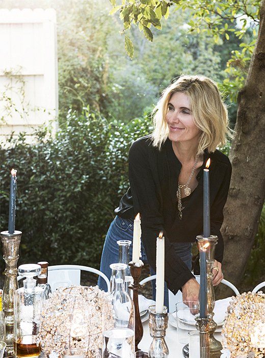 Amy putting the finishing touches on her dinner-party table.
