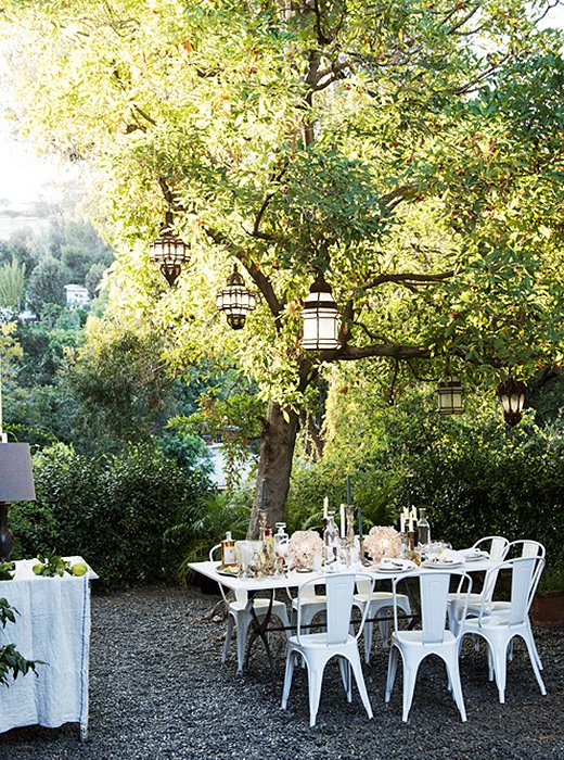 The Moroccan lanterns strung in the trees are on dimmers, which allows Amy to control the mood even from the dinner table thanks to a handy remote.
