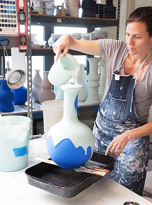 After the shapes are bisque-fired, each lamp gets several coats of glaze to produce a rich color.
