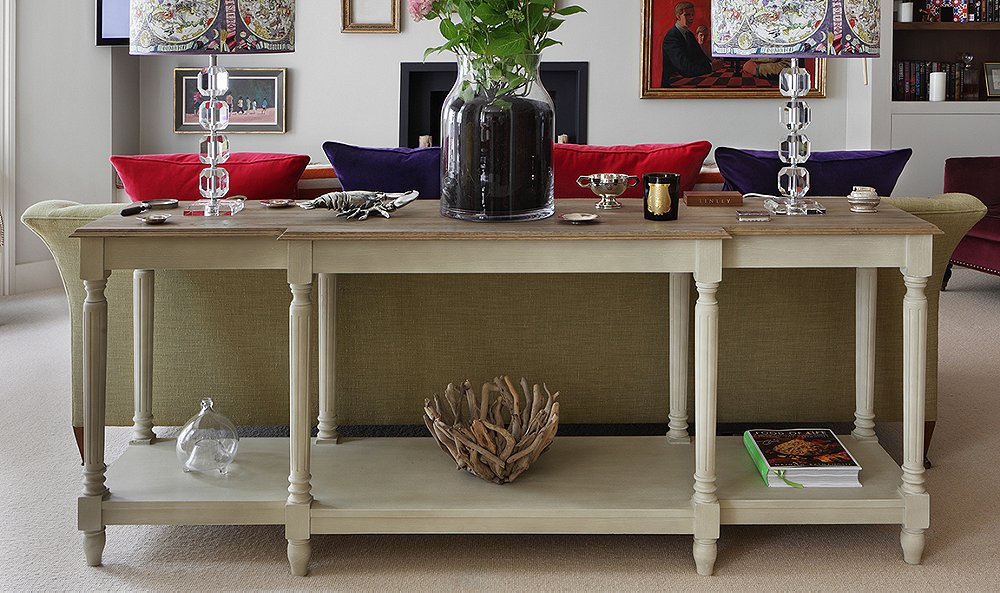 console table under window living room