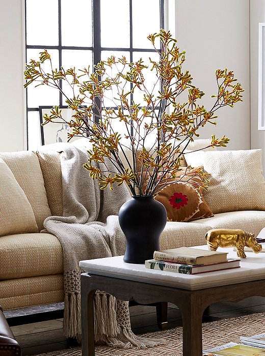 Styled on their own, long-stemmed kangaroo pod branches make a simple statement. 
