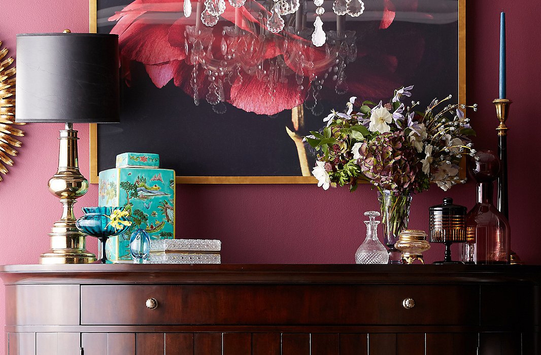 Plum hydrangeas, purple clematises, silver bells eucalypti, and a smattering of white cosmos make for a seasonally appropriate tonal look. 
