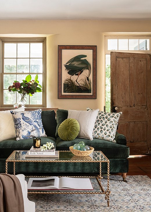 The Brooke 2-Seat Sofa in Forest Green Velvet sings in a small sitting room. Fun pillows add some much needed texture, while a streamlined coffee table (like the Hyannis shown above) frees up visual real estate. Photo by Helen Norman.
