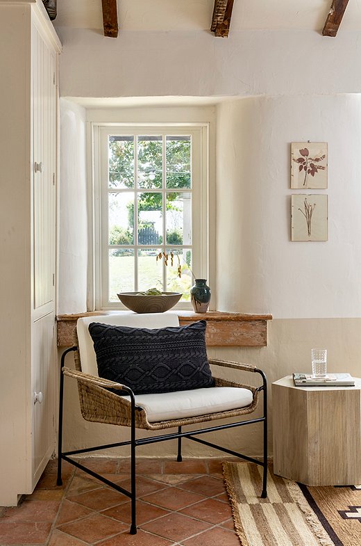 Sculptural items, such as this rattan-and-metal chair, are great ways to add a level of interest into your design. Photo by Helen Norman.
