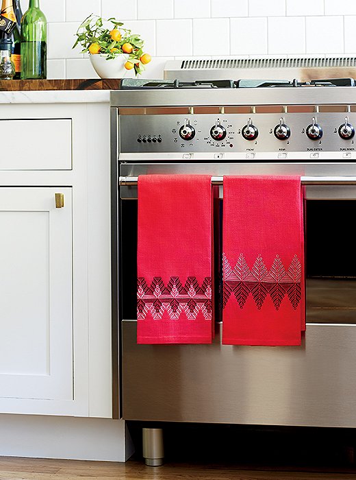 Nordic patterns on bright tea towels elevate (and holiday-ize) the whole space.
