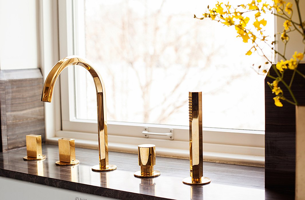 The insanely gorgeous gold-plated fixtures are from Fantini Rubinetti. Though they appear utterly contemporary, Julia says they remind her of 1980s New York City hot spot Mr. Chow.
