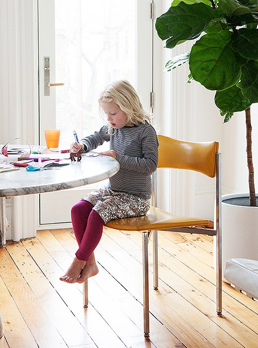 A typical day centers around the dining table. It functions as Julia’s home office, her daughter’s arts-and-crafts station, and the dinner table.
