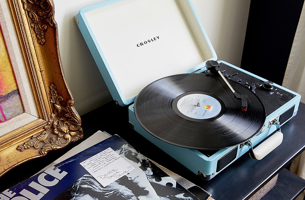The records next to their Crosley player were a wedding gift from a friend. “He chose some of his favorite records and gave them to us, along with little handwritten notes describing what he loved about it or why he thought Marlon or I might like it,” Lisa says. “It was such a sweet and sentimental gift.”
