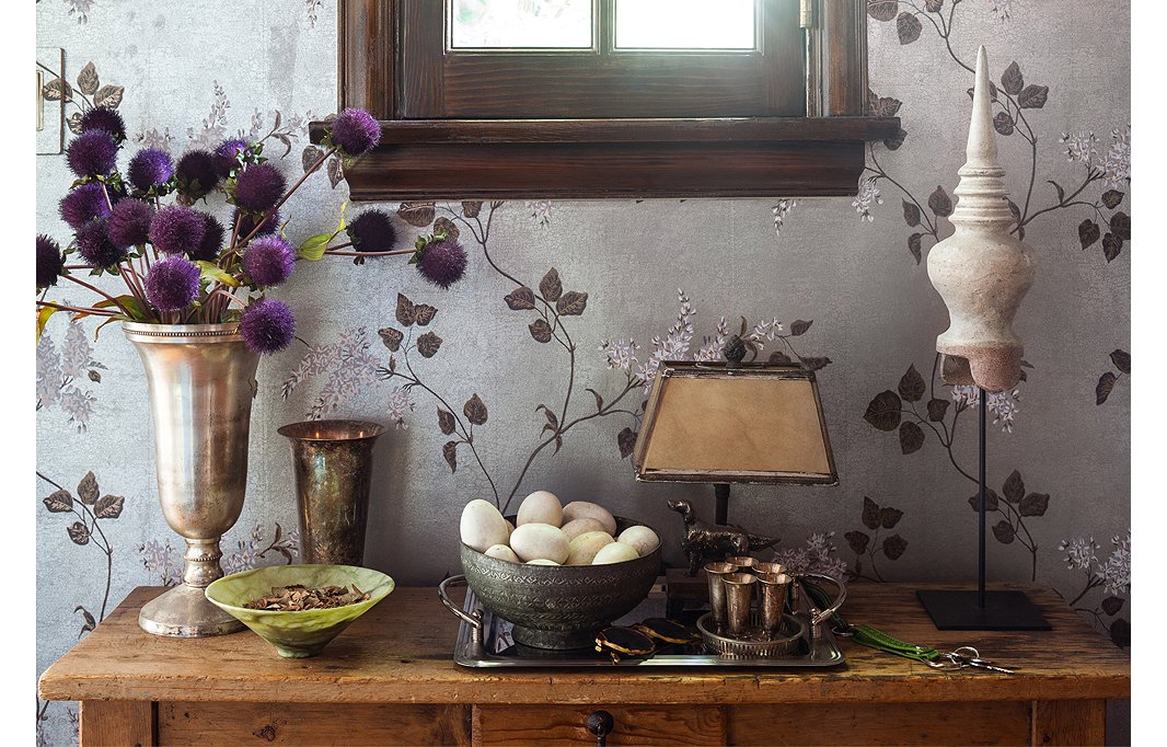 Grouping together various silver accessories, accented with a few welcome bits of tarnish, makes an otherwise haphazard grouping feel cohesive. Lulu has a special fondness for her husband’s collection of plaster eggs, safely stored in a vintage metal bowl.
