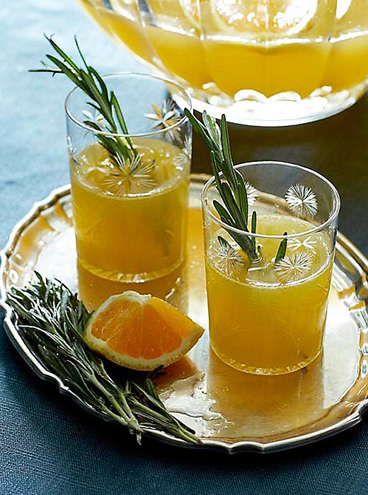 What’s hot this holiday hosting season? One word: punch. Join the party with this festive, rosemary ginger version, and let your guests play barkeep.<img class=”alignnone” src=”https://okl.scene7.com/is/image/OKL/119%2D04a%2DCHRISTMAS%5FCOCKTAILS%5FFULL%5FRGB%5FRT%5FLLHcrop?$%5FLLH%5FObsessions$” alt=”” width=”600″ height=”600″ data-mce-src=”https://okl.scene7.com/is/image/OKL/119%2D04a%2DCHRISTMAS%5FCOCKTAILS%5FFULL%5FRGB%5FRT%5FLLHcrop?$%5FLLH%5FObsessions$” />Inspired by the punch craze, we crafted this recipe: a take on traditional champagne punch with seasonal citrus, herbaceous and woody rosemary, and warm and spicy fresh ginger. We suggest paying homage to 1950s-style entertaining and serving it in a vintage punch bowl, but a pitcher or a drink dispenser work just as well. So mix it up, set it out, and let your guests help themselves.<strong>Rosemary Ginger Sparkling Punch</strong><br />
<em>Serves 15</em><strong>Ingredients:</strong><li>1 cup sugar</li><li>2 tablespoons rosemary leaves, roughly chopped</li><li>1 two-inch piece of ginger, thinly sliced</li><li>2 bottles dry sparkling wine (such as brut champagne or cava)</li><li>2 cups ginger ale</li><li>2 cups fresh-squeezed orange juice</li><li>Orange slices and rosemary sprigs, for garnish</li>
1. Combine sugar, rosemary leaves, and ginger in a small saucepan with 1 cup of water. Cook over low heat, stirring occasionally, until sugar dissolves. Set the syrup aside to steep for at least 1 hour.2. Strain the syrup into a punch bowl or a pitcher, and add the remaining ingredients. Mix well, and garnish with orange slices and rosemary sprigs, if desired.<i>Note: Strained syrup can be made ahead and kept in the refrigerator, covered, up to 1 week.</i><em>Photography by Manuel Rodriguez</em>
