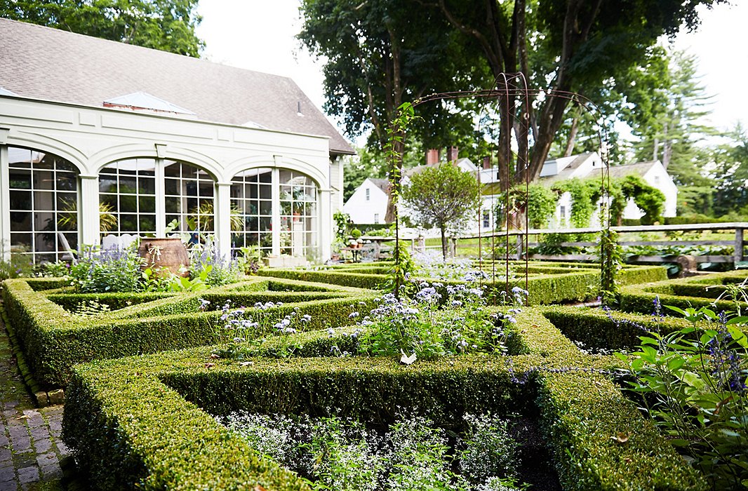 For the formal parterre gardens, visible from the conservatory where Bunny does much of her entertaining, part of the decision to create a box structure was the beautiful view it provided year-round, whether filled with annuals in the summer or covered with snow in the winter.
