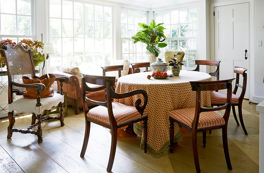 Bunny and John eat breakfast (including eggs from their own chickens) at this table in the kitchen while the dogs sit on the leather couch—known as “the dogs’ TV”—looking out at the world.
