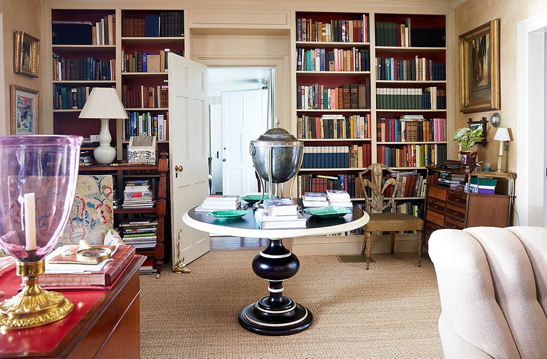 Bunny is a big fan of urns, and she often fills this patinated brass-and-iron one with flowers. The table is from Bunny Williams Home; the green dishes are antique Wedgwood.
