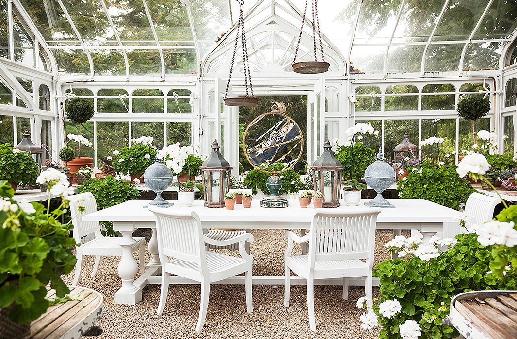 Carolyne “prettified this little glasshouse” with lots of geraniums and a mix of metals.
