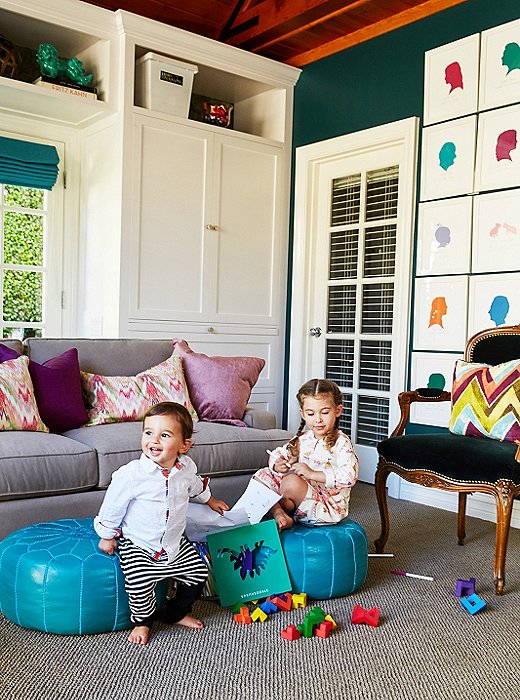 The multiuse space is sophisticated yet child-friendly. It cleverly mixes and matches Middle Eastern touches—the poufs and ikat pillows—with classical European elegance, such as this Louis XV-style chair.
