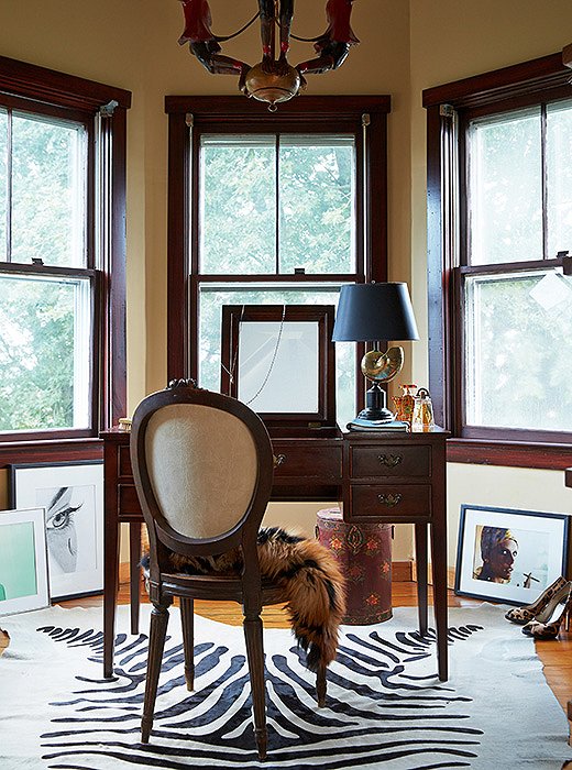 Nestled into the home’s traditional Victorian turret is Delaney’s home office. When she moved to the Hamptons, she brought along several pieces from her prewar apartment in Manhattan, including the antique monkey chandelier from William-Wayne & Co. Antiques that hangs above her desk.
