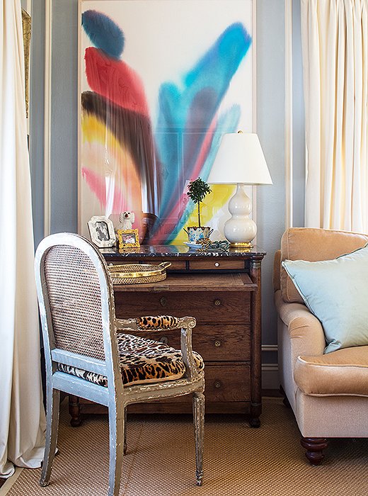 A leopard-print chair and the lovely watercolor Bachmann lucked upon at a secondhand store add interest to the soothing, sedate space.
