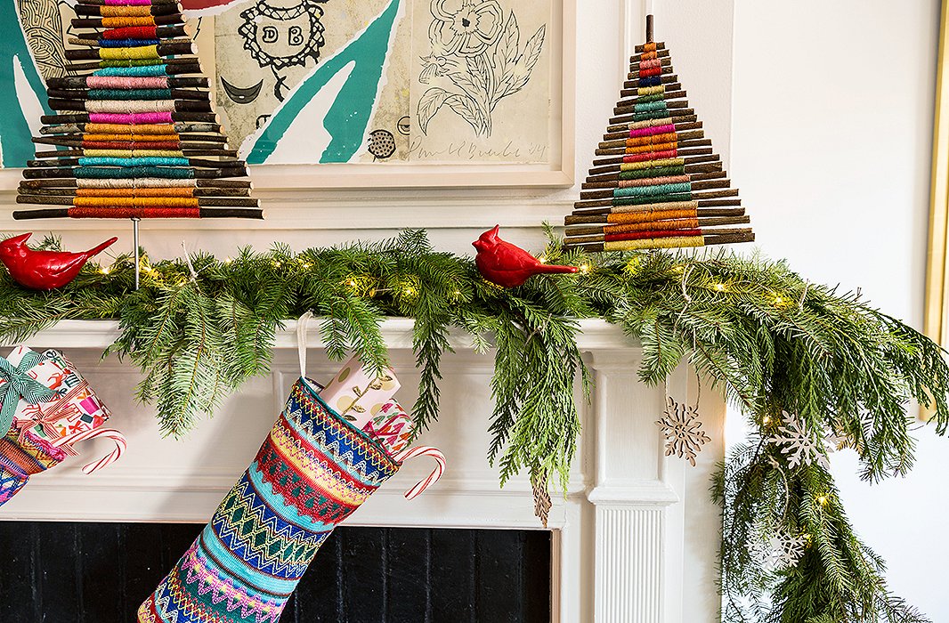 The handmade, organic feel of the twig trees Lilly used to decorate the mantel feel festive but not so refined that an ornament made by the kids couldn’t hang nearby.
