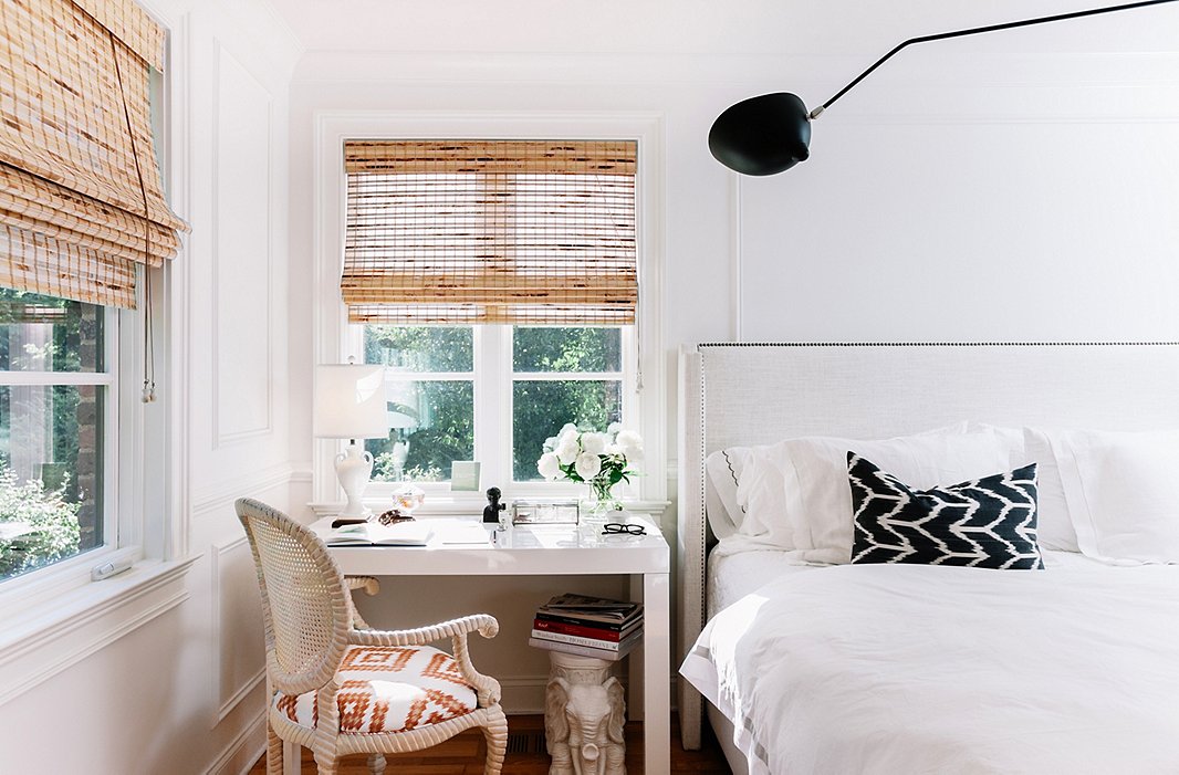A desk does double-duty as a nightstand. Gen used one of her vintage fabrics—sourced from a secret supply in San Francisco—on the chair’s seat.
