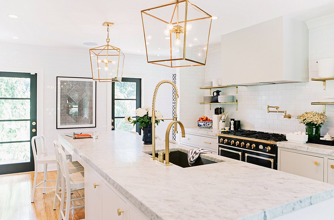 While they couldn’t save the home’s original brass hardware, it inspired the new kitchen’s hardware. As for the ceiling fixtures, they went big. “With lighting, nothing is more important than scale. Tiny pendants over a kitchen island kill me,” says Gen. Find a similar fixture here.
