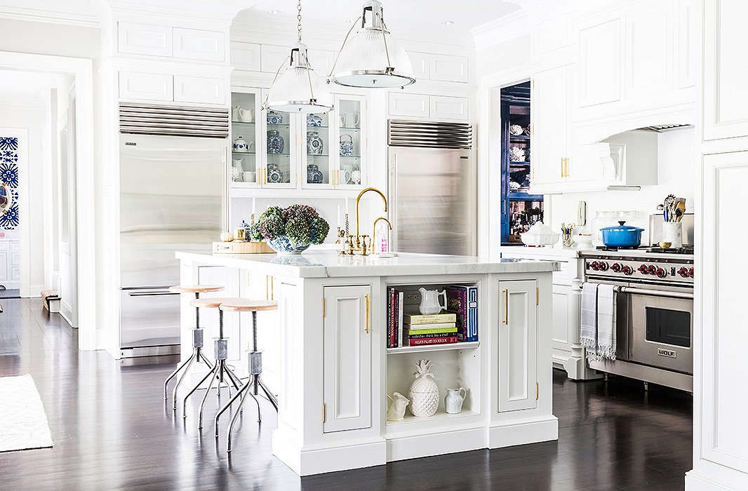 Sue embraces mixed metallics in the kitchen via the silver-trimmed ceiling pendants, saved from the family’s former house (“Those were the first expensive things I ever bought,” she says) and brass faucets and hardware.
