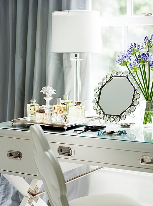 A desk designed by Suzanne for Hickory Chair stands in as a dressing table in the master bath.
