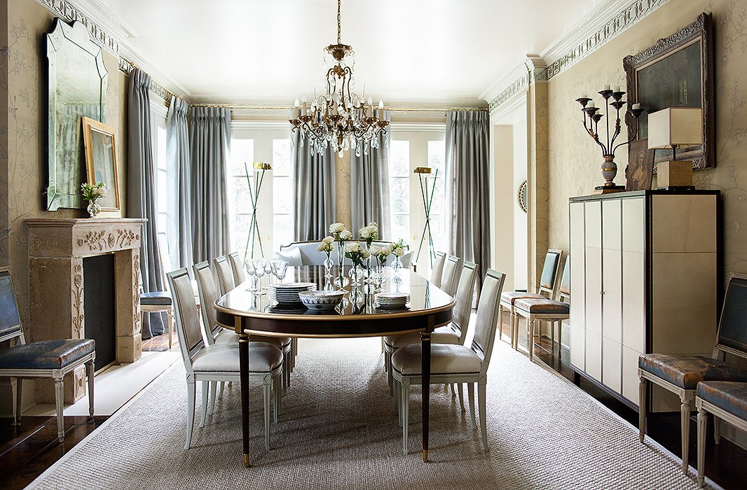 The dining room sparkles, thanks in part to mirrored molding that runs around the cornice line. Suzanne used a metallic paint on the ceiling to capture even more light.
