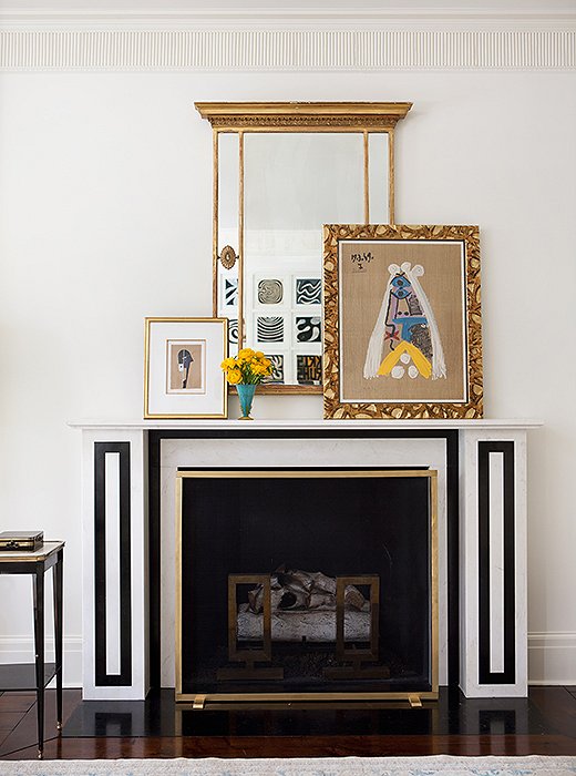 The living room mantel, one of three added to the house, was modeled on an 1824 drawing in the archives of Sir John Soane’s Museum. Paintings casually leaned on the mantel are easy to swap out when the mood strikes.
