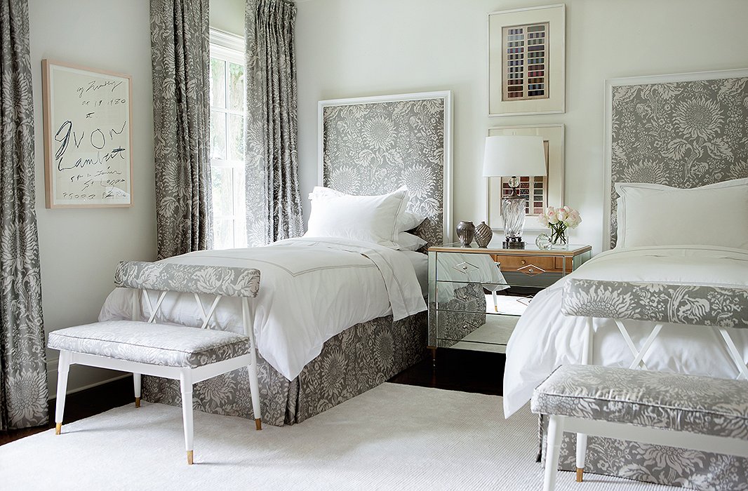 Taking cues from French design, Suzanne repeated a patterned fabric (by Brunschwig & Fils) throughout this guest room. The ribbon artwork above the nightstand comes from Suzanne’s own collection for Soicher Marin.

