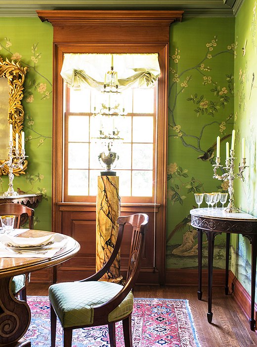 Timothy uses Roman shades throughout the house so as not to obscure the beautiful moldings and casements around the windows; when used for dining, the room is lit entirely by candelabras.
