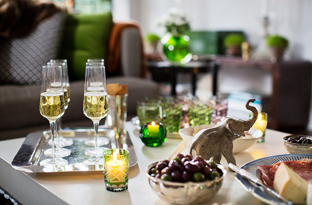 Guests are greeted with filled flutes, beautifully displayed on a silver serving tray.
