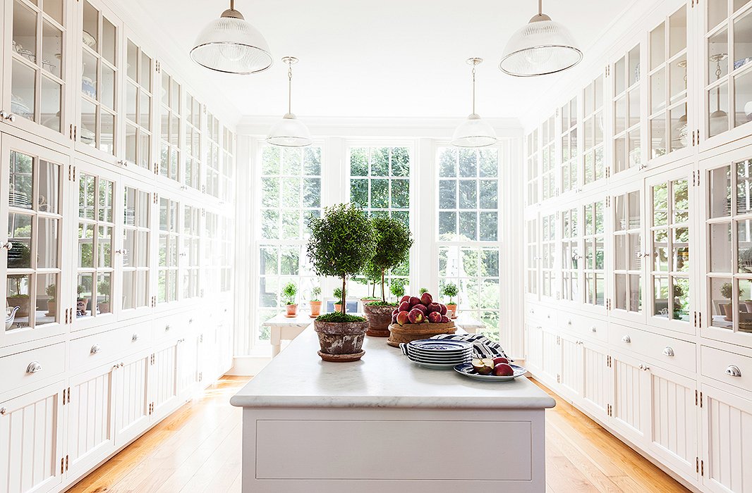 While outfitted with modern features such as a vast marble island, the breakfast room has that key classical element: perfect symmetry.
