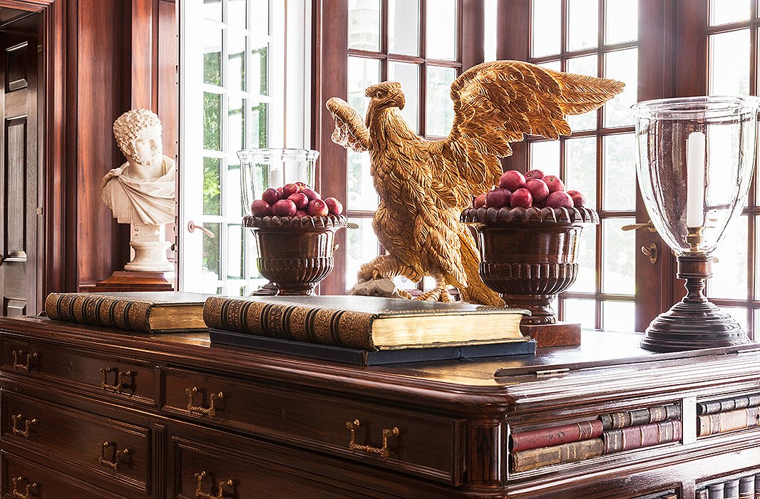 An English library desk is topped with leather, making it ideal for reading the antique books.
