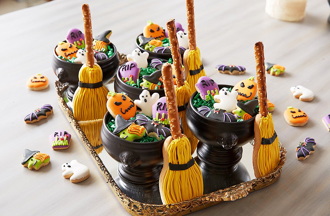 “I love our petite Halloween cookies with the tombstone, ghost, witch, bat, pumpkin, and broom,” says Dylan, who lays them out on a gold-rimmed mirrored tray for an ornate touch that’s in keeping with the theme. “They make great favors, especially when placed in a mini cauldron.”
