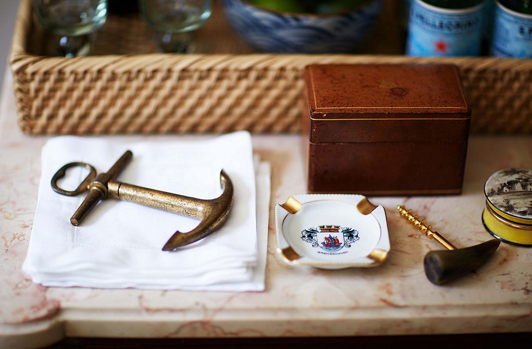 As they say, no one smokes anymore—including Heather—but a beautiful ashtray gives the bar an old-school look.
