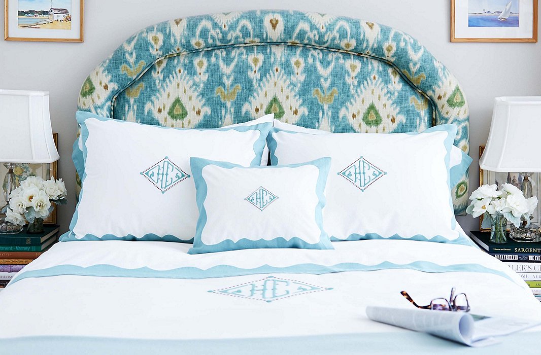 The ikat-upholstered headboard is the one large piece in Heather’s apartment that’s not neutrally hued—instead, the art and the bedding flow around its colors.
