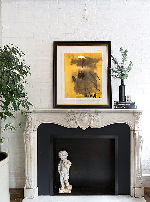 Across from the table, greenery and a leaning print add color; otherwise, the palette here is monochromatic. As Alison says, “Black and white are a great backdrop for food.”
