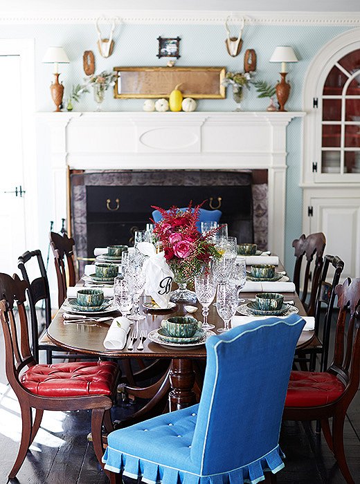 An elegant mix of tableware—lusterware and English pottery, antique silver and crystal—and chairs of heirloom beauty set off a gracious dining scene.
