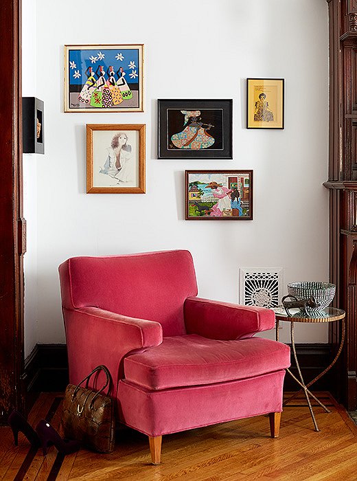 Above a pink chair hang pictures of women: “some working, some not, some modern, some older… all beautiful and confident, thoughtful and creative. I like what it says about us,” Jodie explains.
