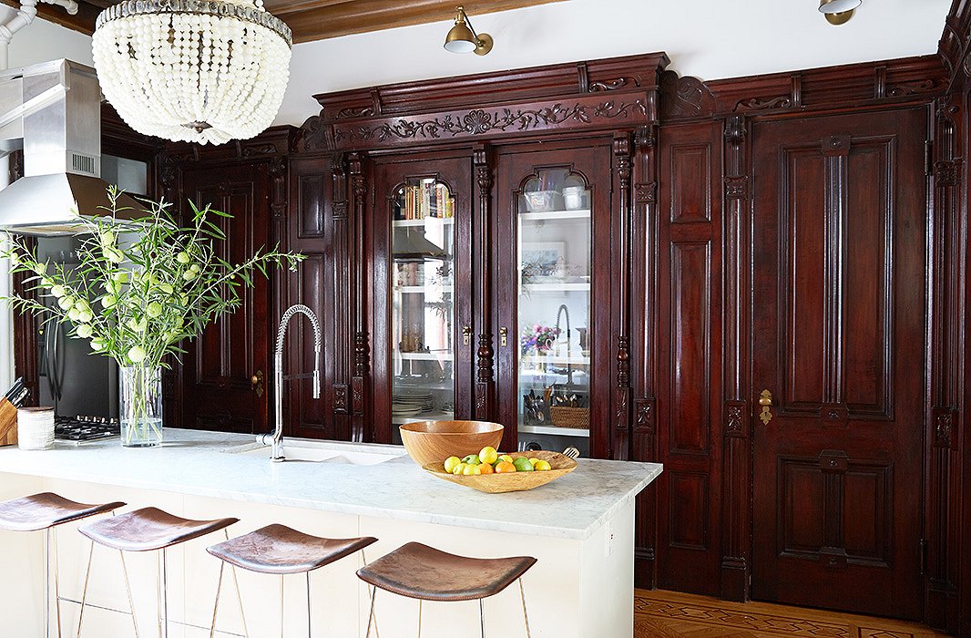 The former master bedroom is now the kitchen—a marble island was added, and the old closets became china cabinets.
