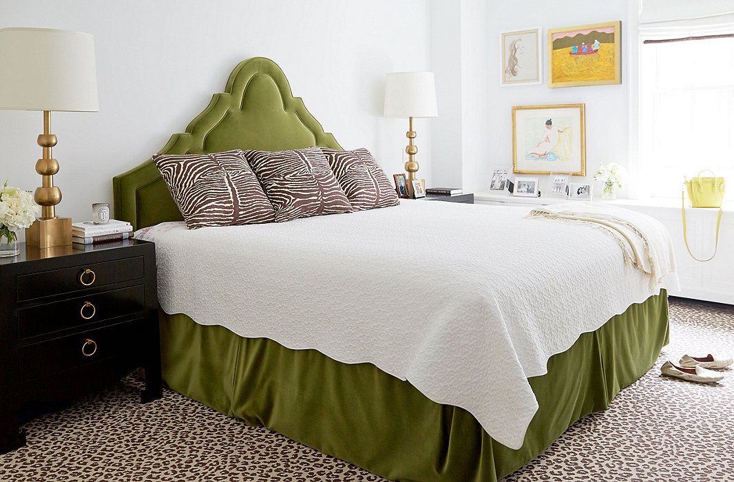 If one animal print is good, are two better? They are in this room. Because the leopard rug and the tiger pillows are both low-key browns, they work together with the dark nightstands to allow the green headboard and bedskirt to be the focal point. Find a similar rug here. Photo by Tony Vu; room by Lilly Bunn.
