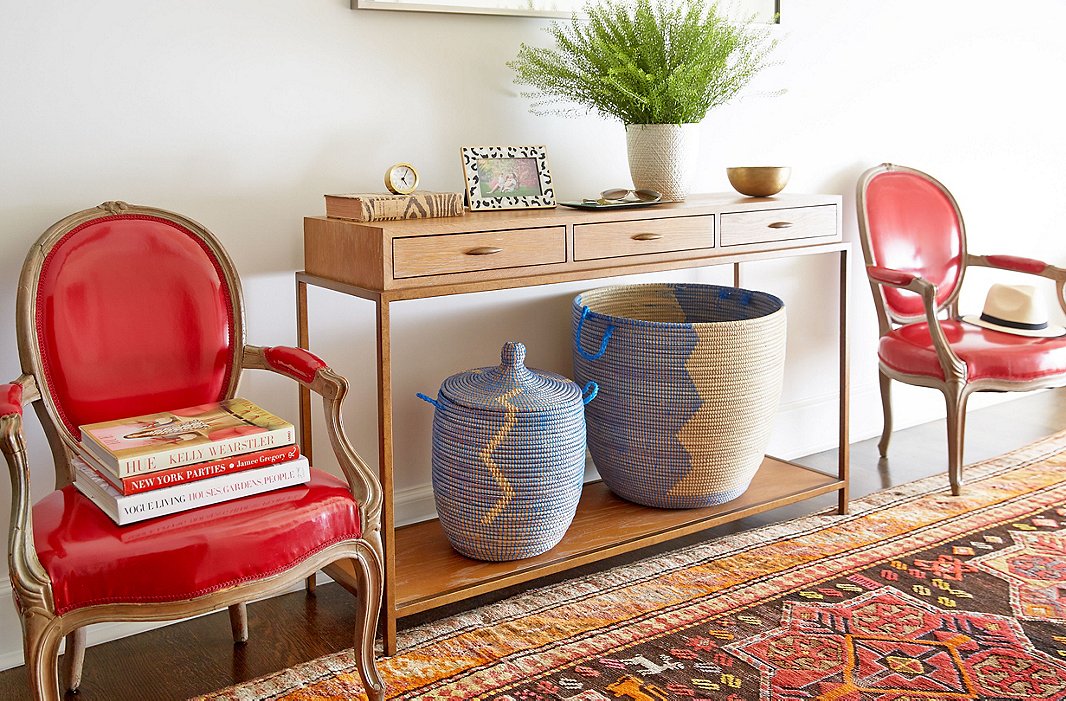 “Normally the entrance hall is all stroller parking,” Amory says. The lidded baskets keep a rein on clutter.

