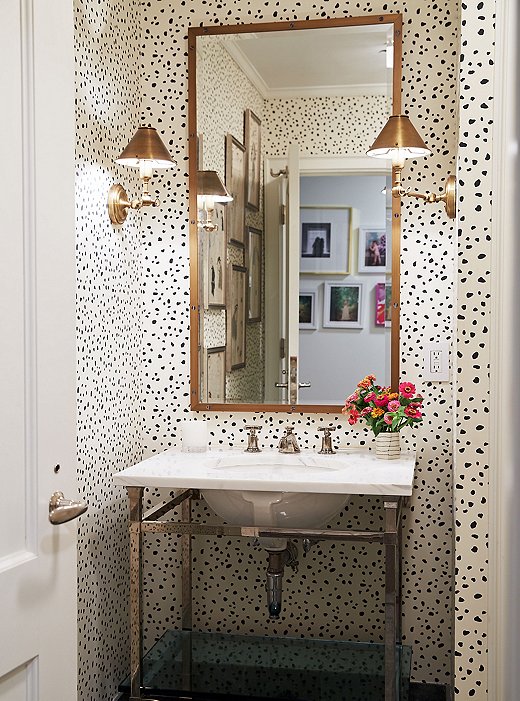 Lilly keeps major walls white but sees no need for restraint in a powder room: “You have less space and less clutter, so you can go for it,” she says. 
