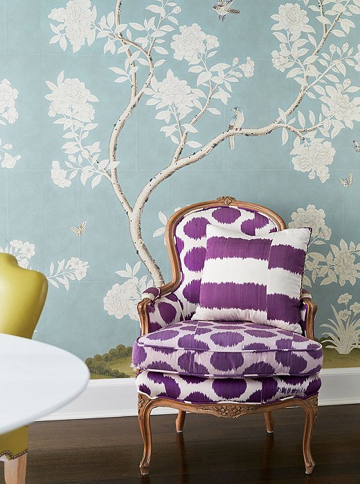 The purple Madeline Weinrib fabric on a pair of bergères balances the dominant palette of blues and greens.
