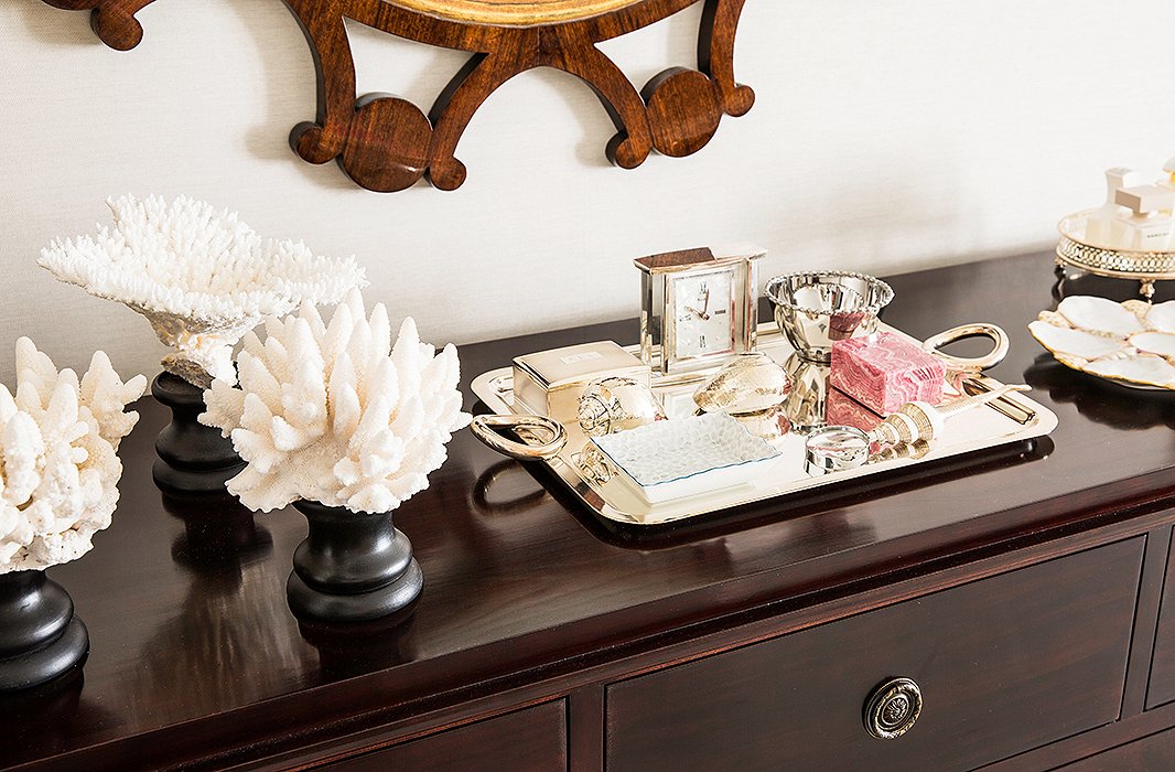 In the master bedroom, a raspberry-colored stone subtly echoes the raspberry tones in the artwork.
